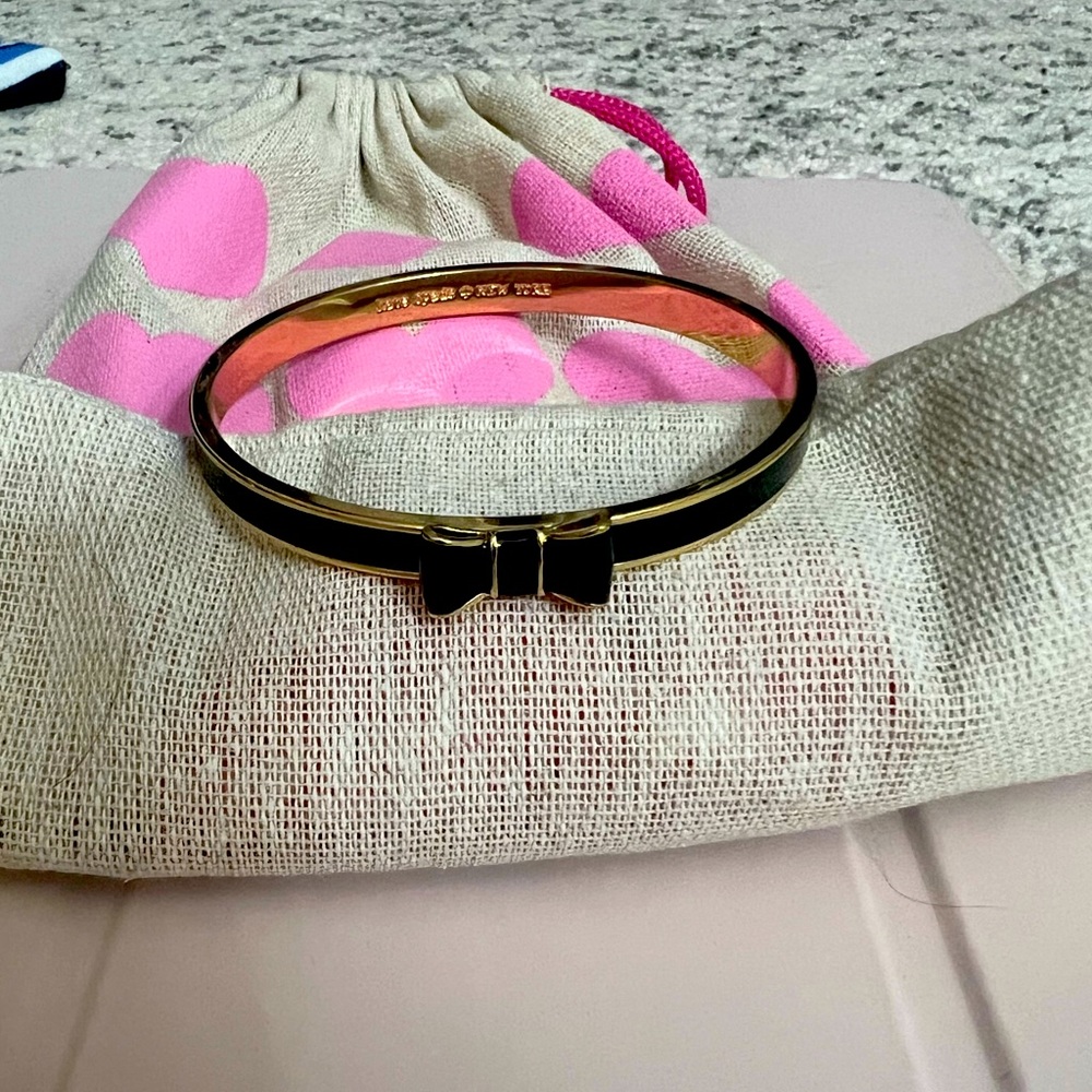 Kate Spade bracelet. Black and gold coloring.